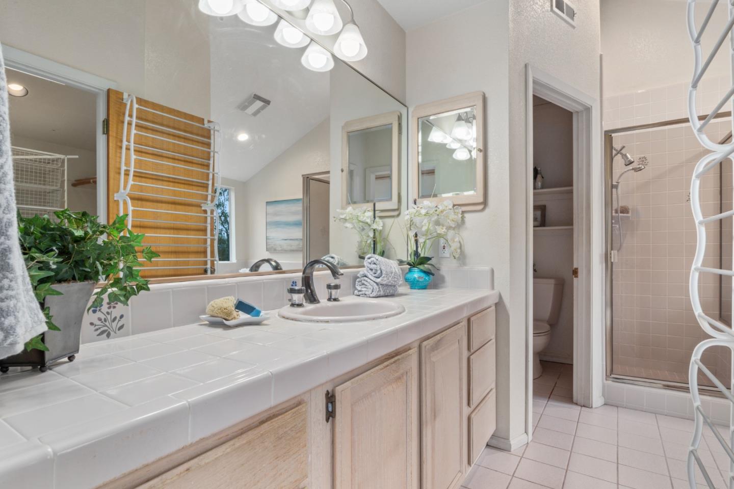 2345 Laurel Glen Road Soquel, CA 95073 - Photo 27 of 63 a bathroom with a granite countertop sink and a mirror