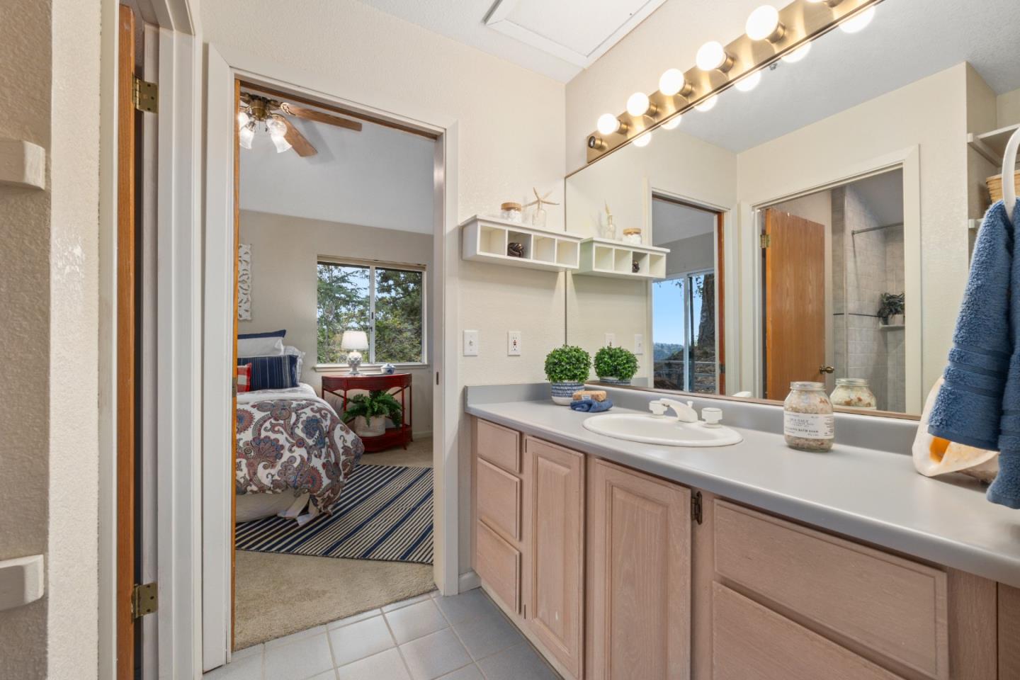 2345 Laurel Glen Road Soquel, CA 95073 - Photo 32 of 63 a en suite bathroom with a double vanity sink and a mirror