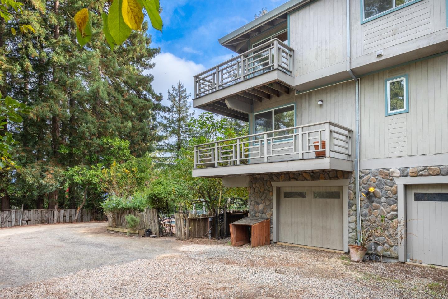 2345 Laurel Glen Road Soquel, CA 95073 - Photo 50 of 63 a view of a cafe with a table and chairs under an umbrella
