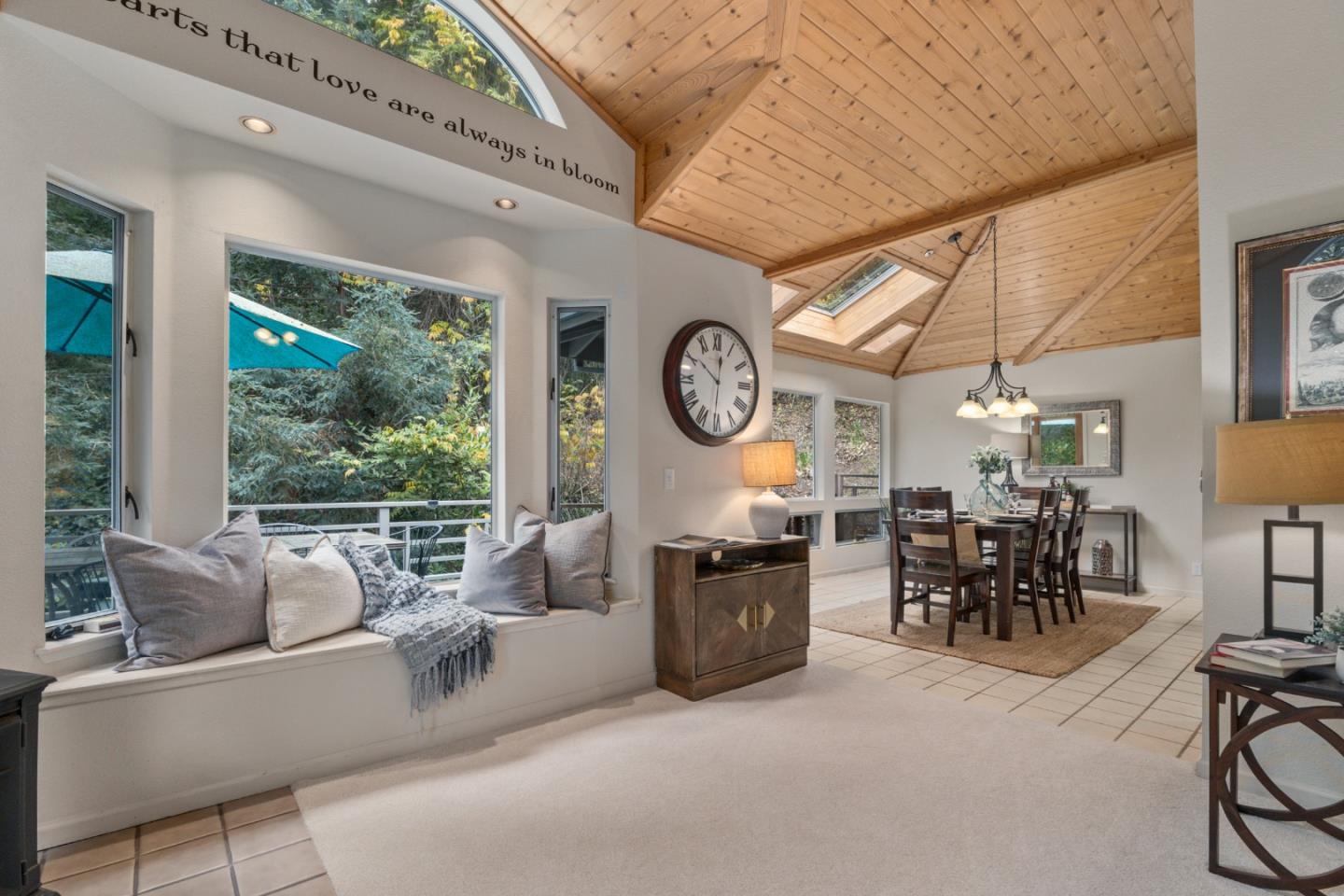 2345 Laurel Glen Road Soquel, CA 95073 - Photo 6 of 63 a living room with furniture a clock and a large window