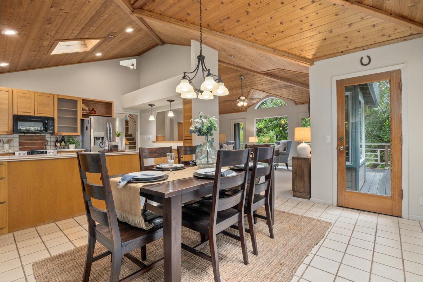 2345 Laurel Glen Road Soquel, CA 95073 - Photo 8 of 63 a dining hall with stainless steel appliances kitchen island a table and chairs in it