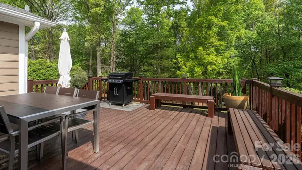 a view of balcony with deck and outdoor seating