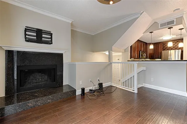 a view of a livingroom with furniture and a fireplace