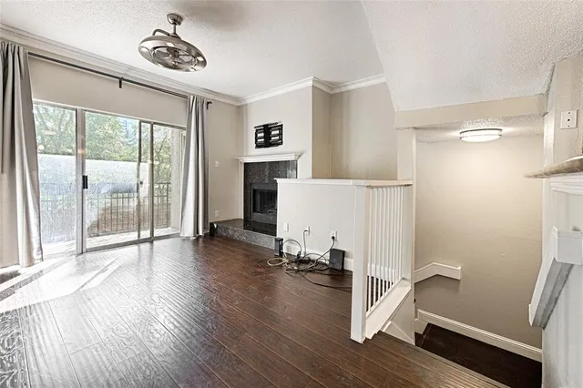 a view of a room with gym equipment and a large window
