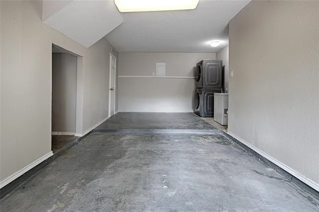 a view of a room with gym equipment and a window