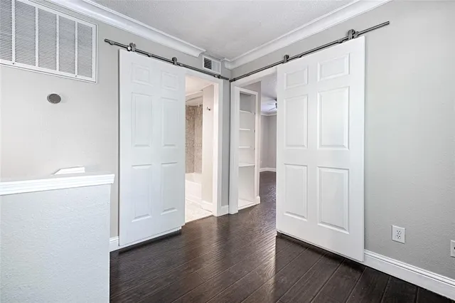 a view of entryway with wooden floor