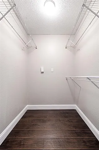 a view of a room with racks on the wall