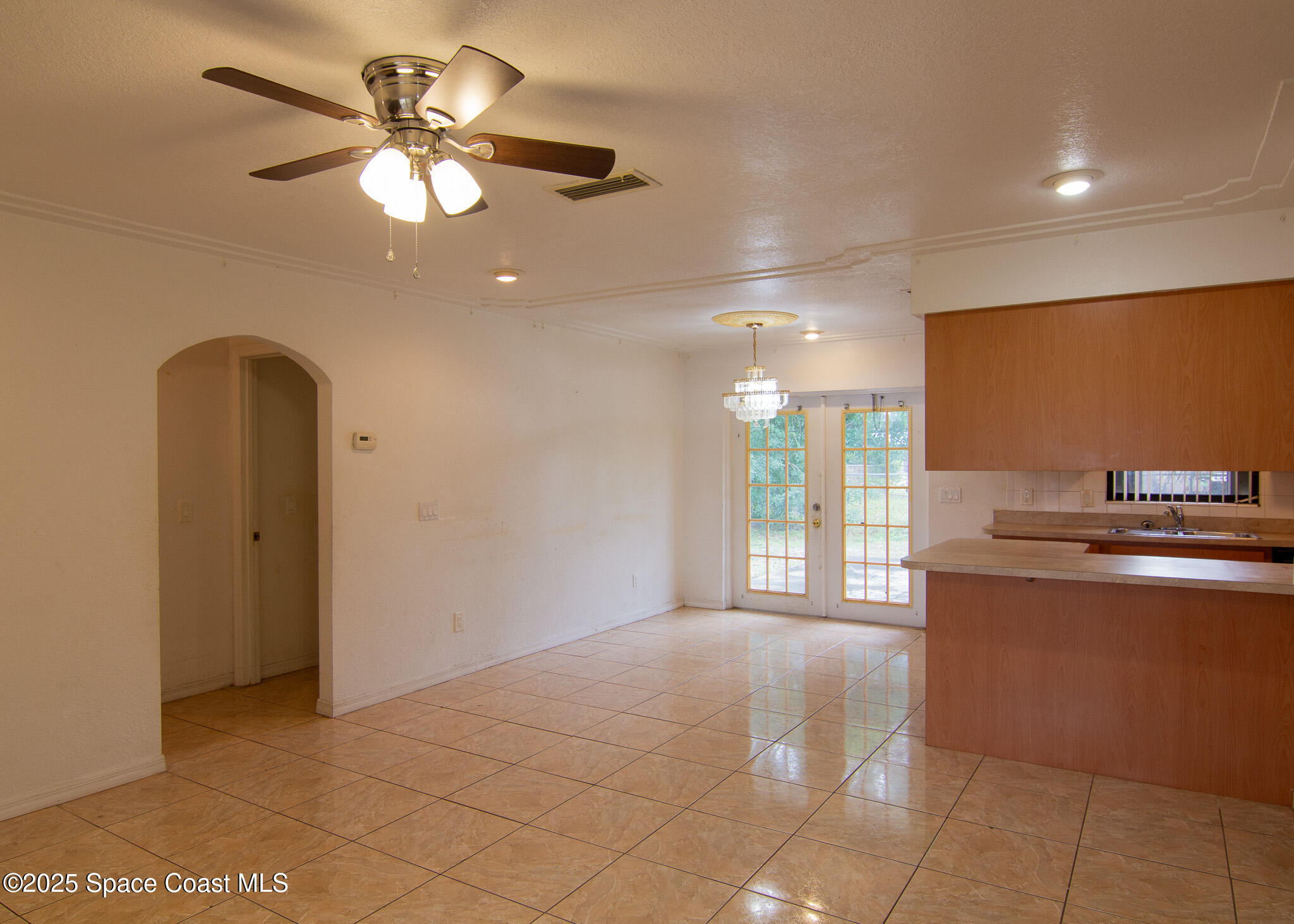 981 Palmer Street Rockledge, FL 32955 - Photo 11 of 38 a view of a livingroom with a kitchen