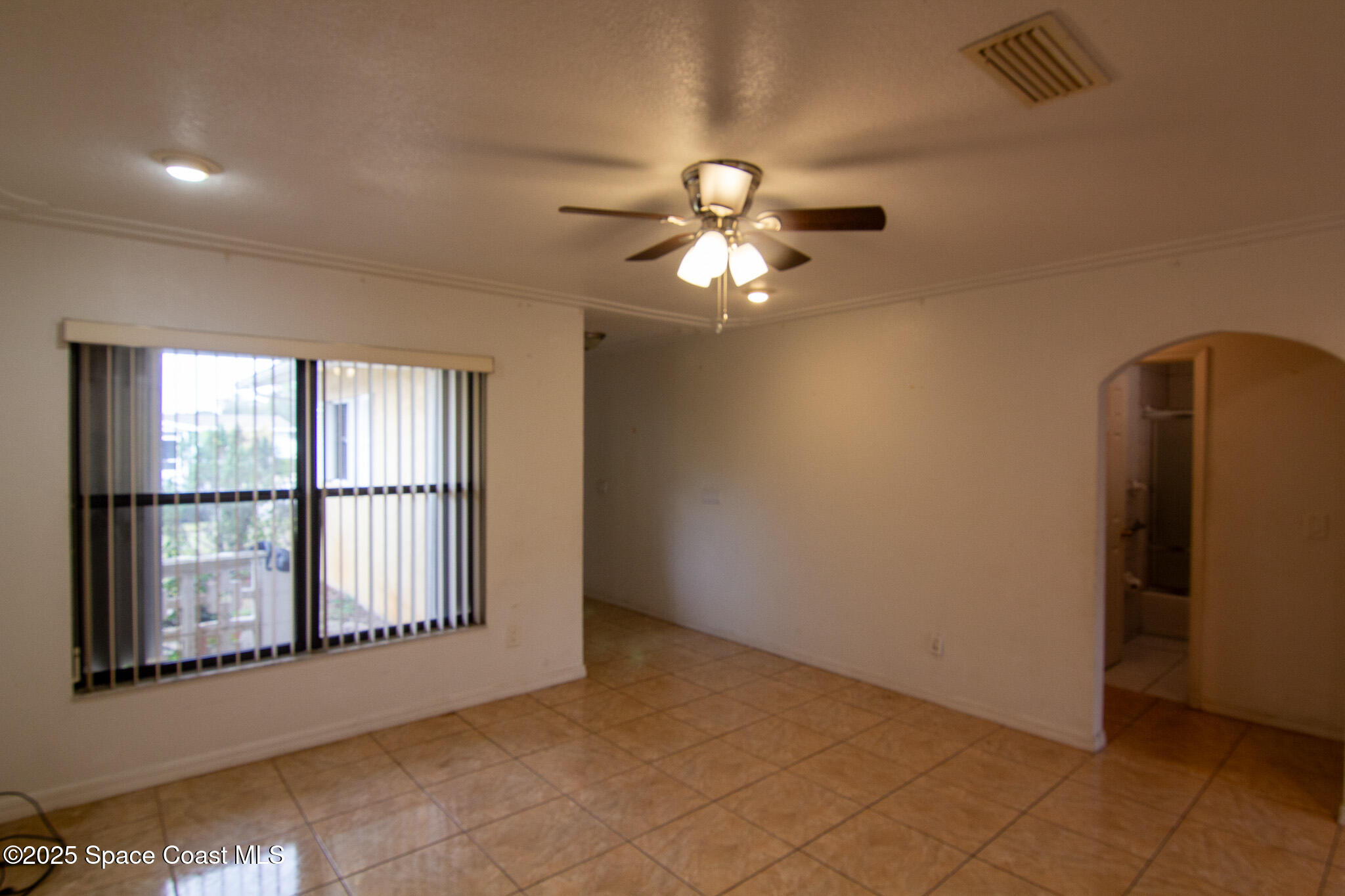 981 Palmer Street Rockledge, FL 32955 - Photo 12 of 38 a view of an empty room with a window