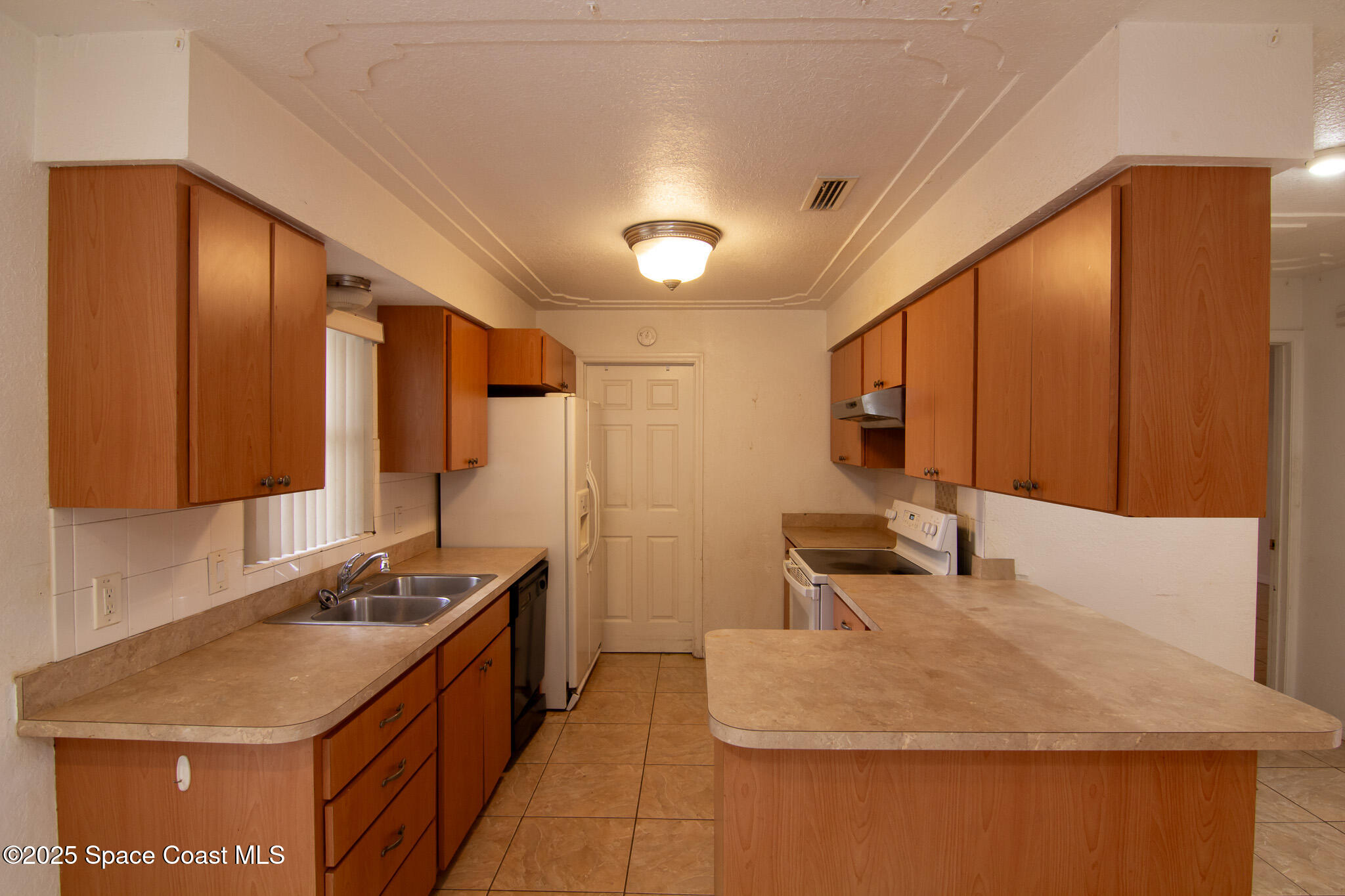 981 Palmer Street Rockledge, FL 32955 - Photo 13 of 38 a bathroom with a sink and a mirror