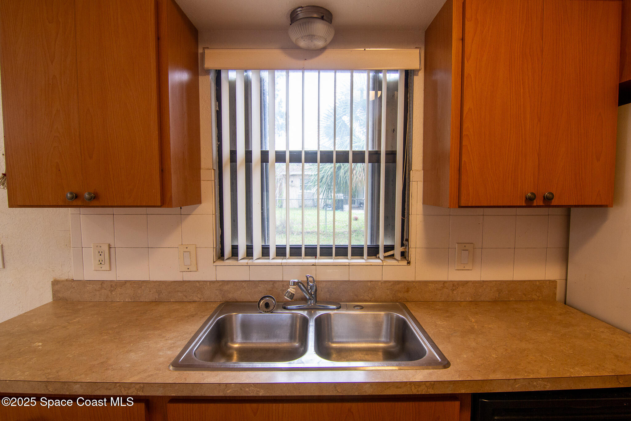 981 Palmer Street Rockledge, FL 32955 - Photo 18 of 38 a close view of sink and tap