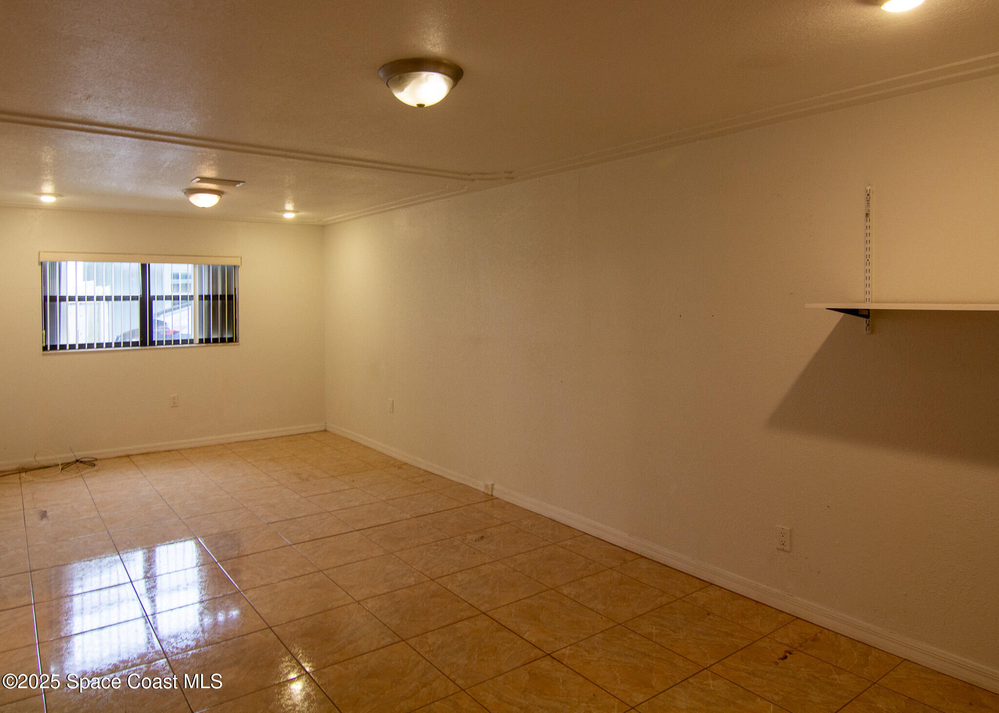 981 Palmer Street Rockledge, FL 32955 - Photo 21 of 38 an empty room with windows