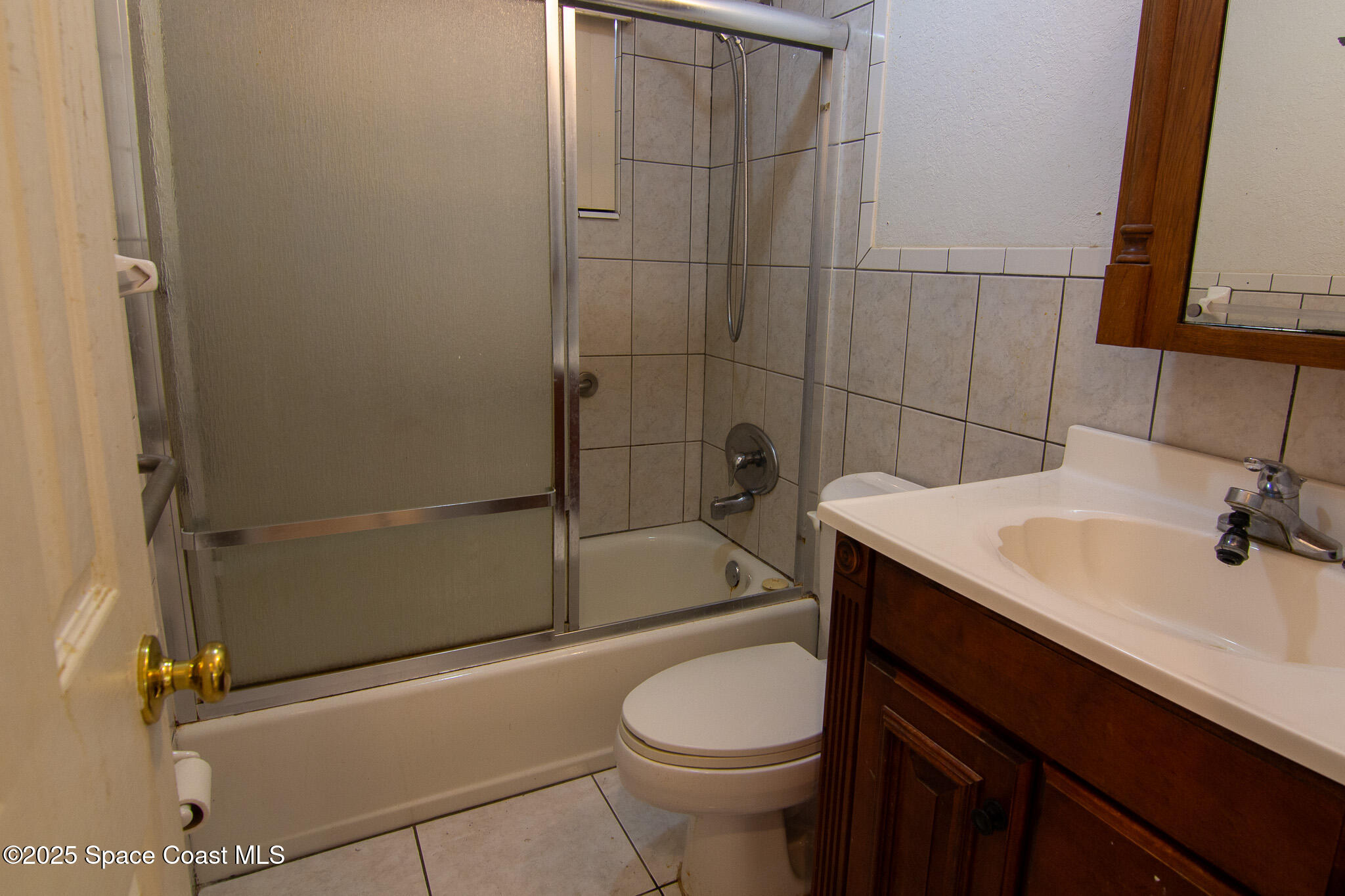981 Palmer Street Rockledge, FL 32955 - Photo 29 of 38 a bathroom with a sink a toilet and shower