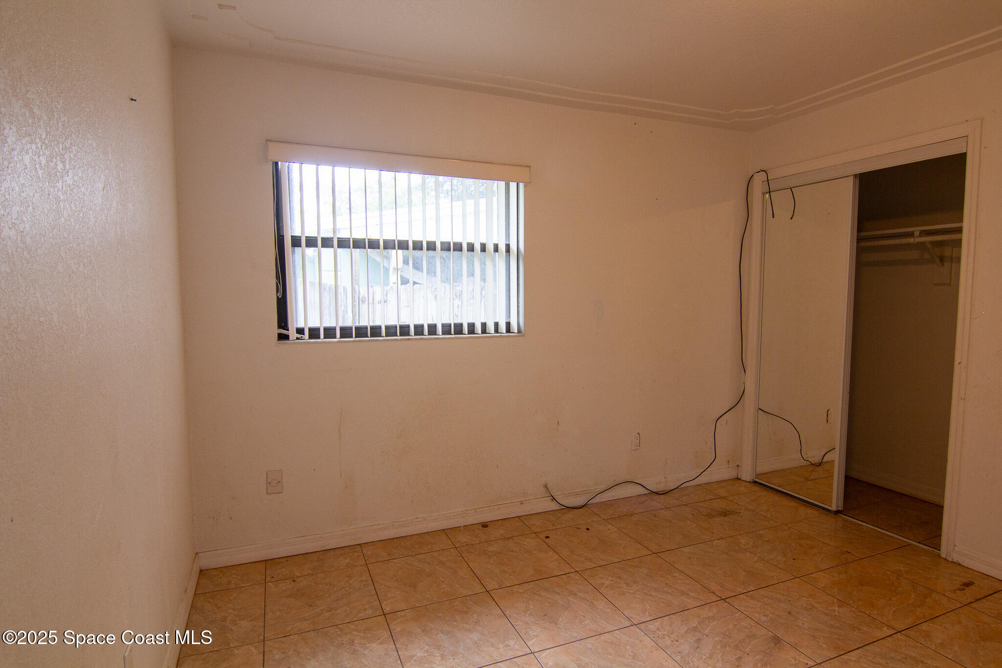 981 Palmer Street Rockledge, FL 32955 - Photo 32 of 38 an empty room with windows