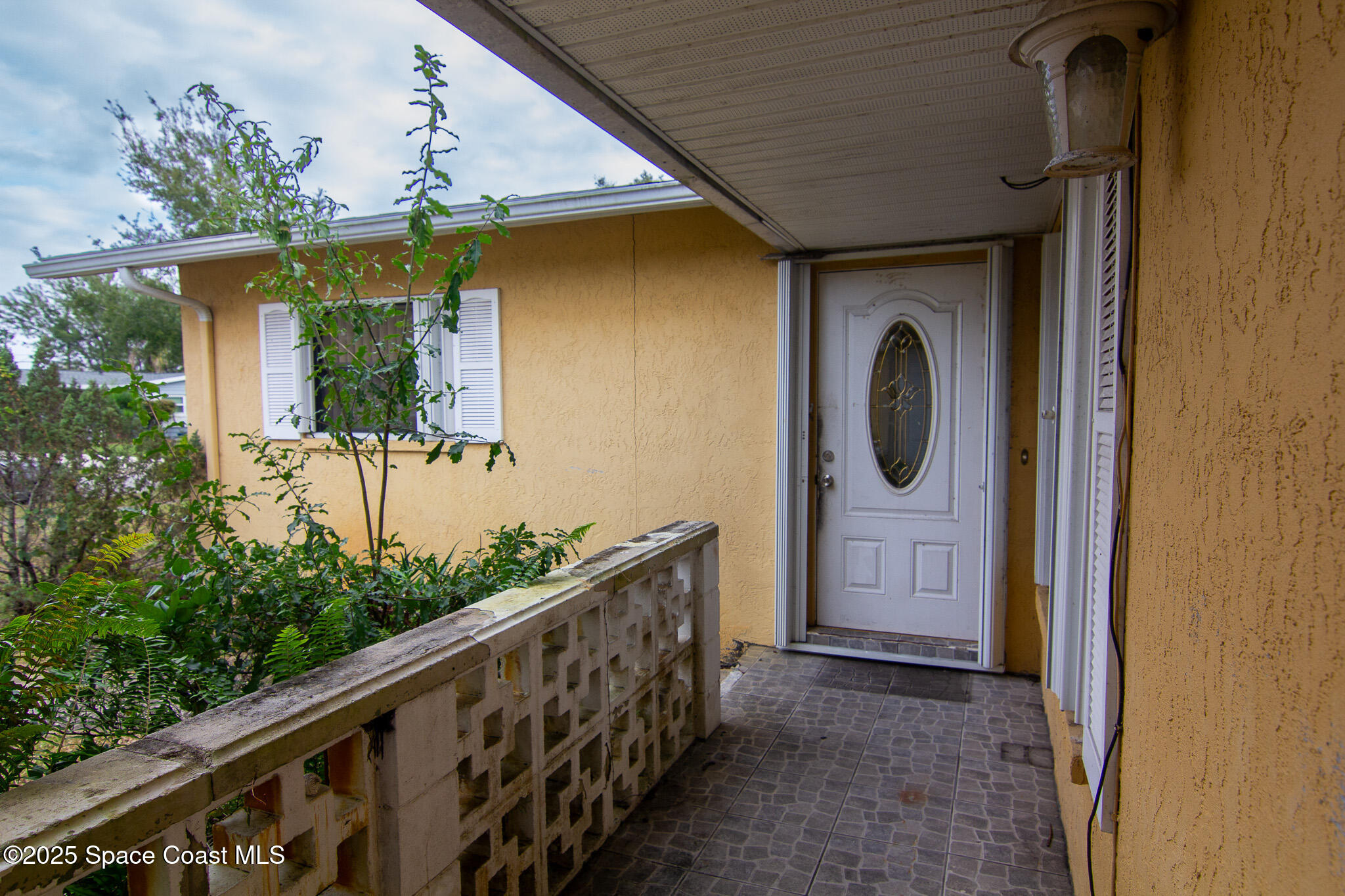 981 Palmer Street Rockledge, FL 32955 - Photo 9 of 38 a view of a house with a porch