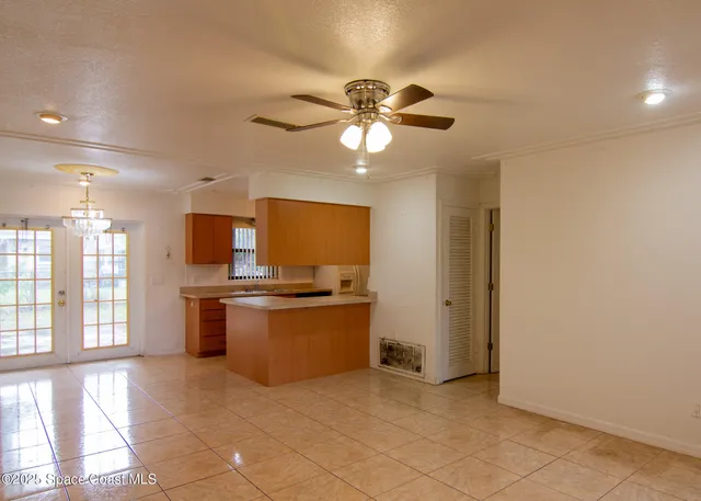 a kitchen with stainless steel appliances granite countertop a stove and a refrigerator