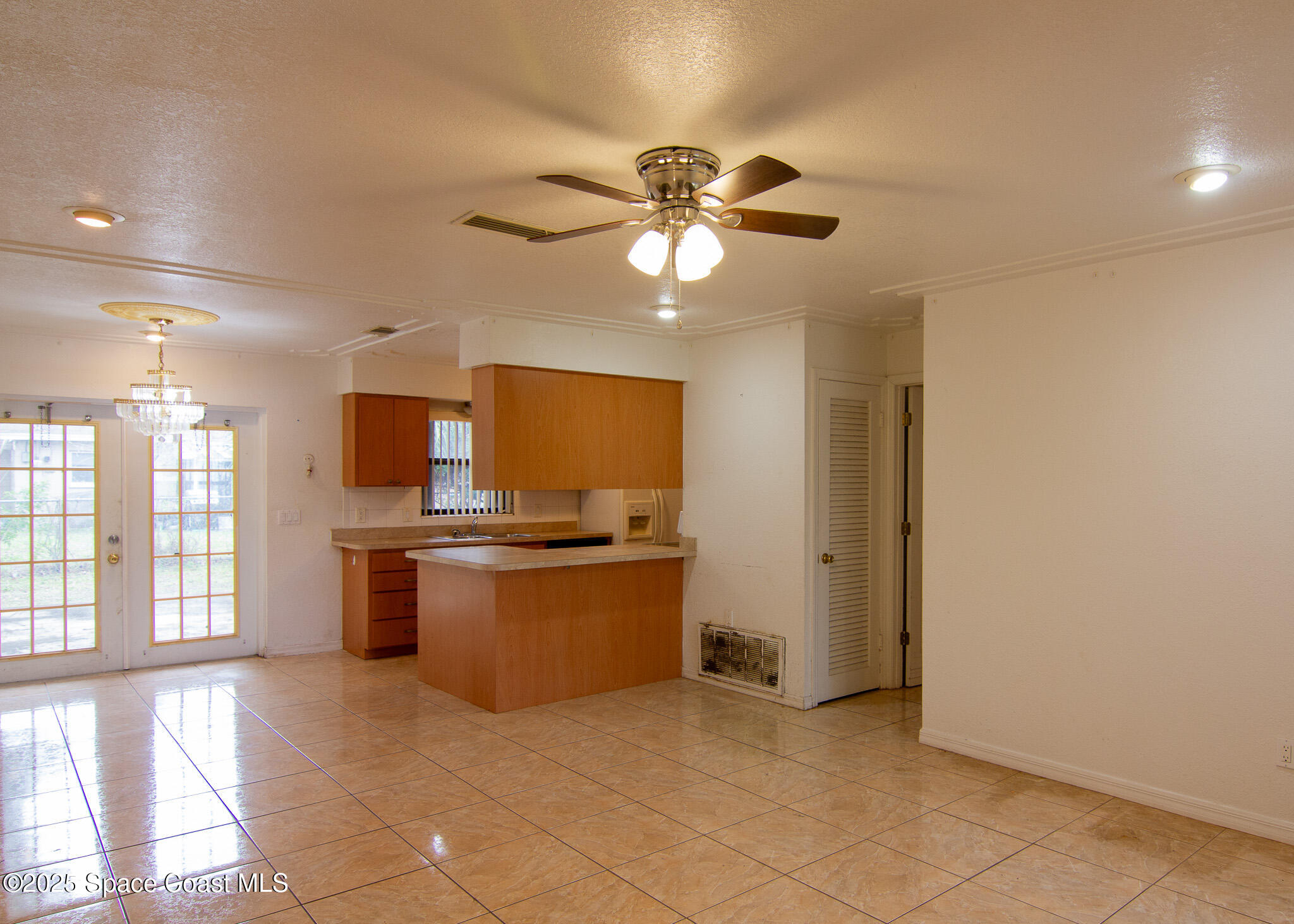 981 Palmer Street Rockledge, FL 32955 - Photo 10 of 38 a kitchen with stainless steel appliances granite countertop a stove and a refrigerator