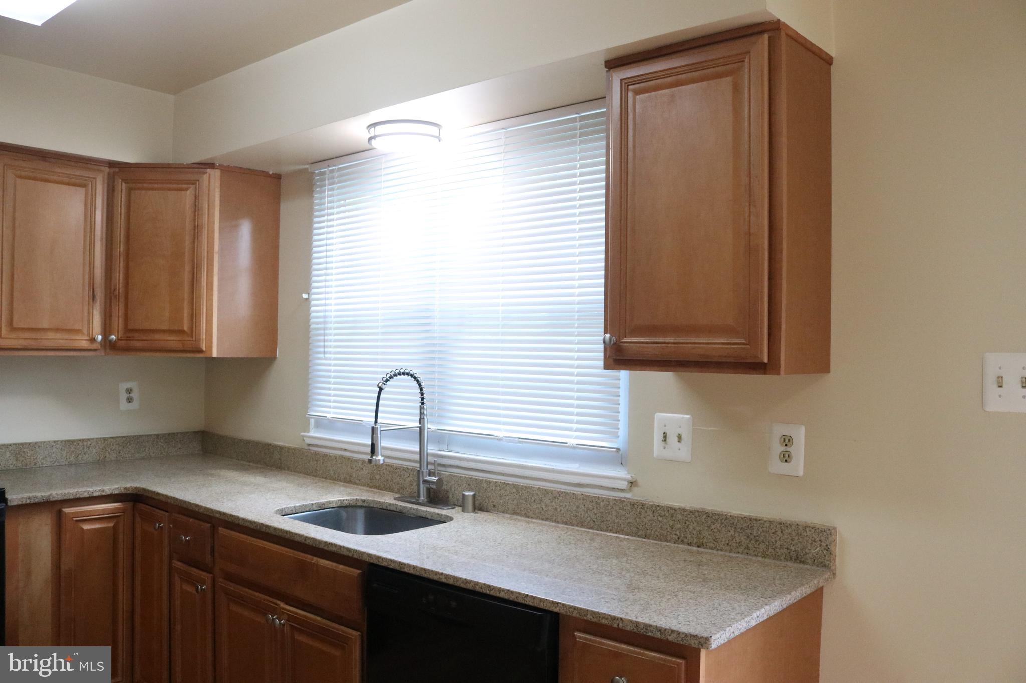 17 Habersham Court Silver Spring, MD 20906 - Photo 20 of 40 a kitchen with a sink and cabinets
