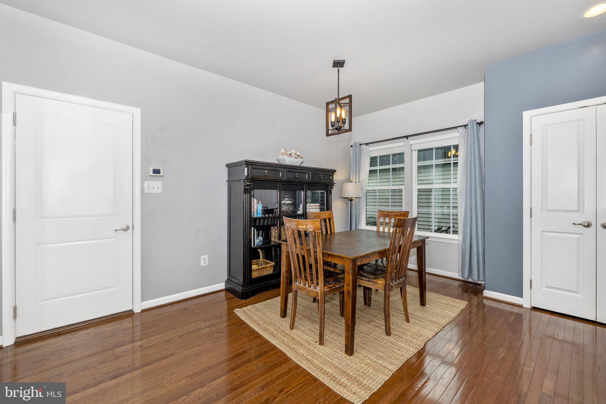 1912 Regiment Way Frederick, MD 21702 - Photo 13 of 45 a view of a dining room with furniture window and wooden floor