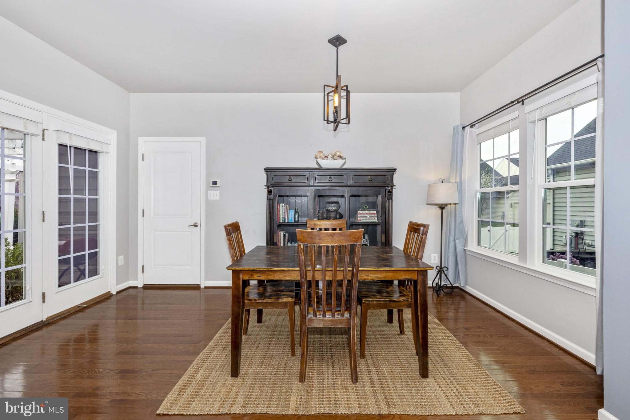 1912 Regiment Way Frederick, MD 21702 - Photo 14 of 45 a view of a dining room with furniture window and wooden floor