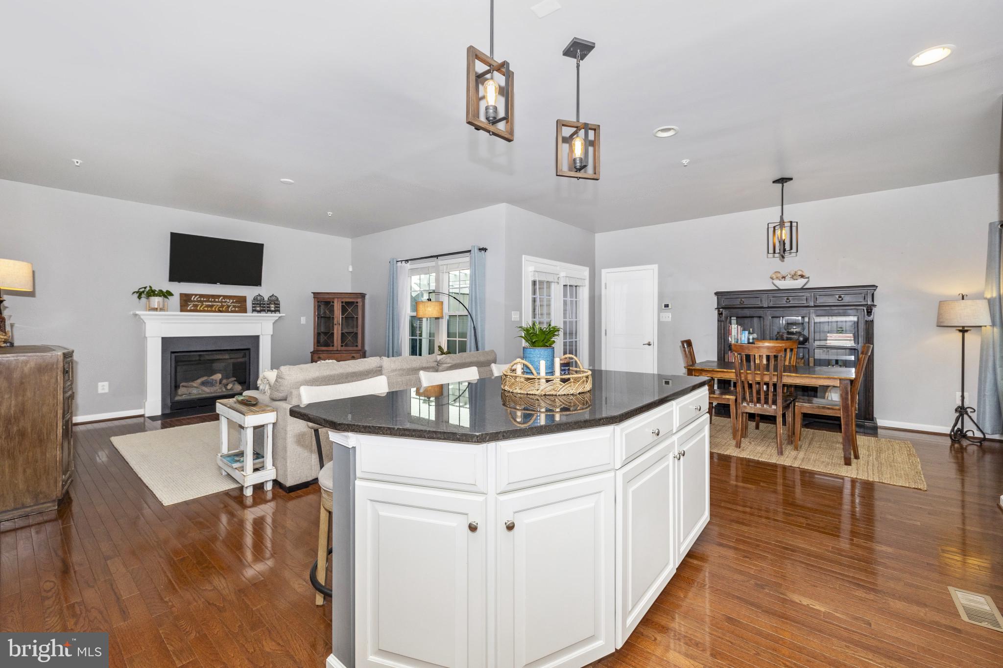 1912 Regiment Way Frederick, MD 21702 - Photo 17 of 45 a kitchen with stainless steel appliances granite countertop a sink and a refrigerator