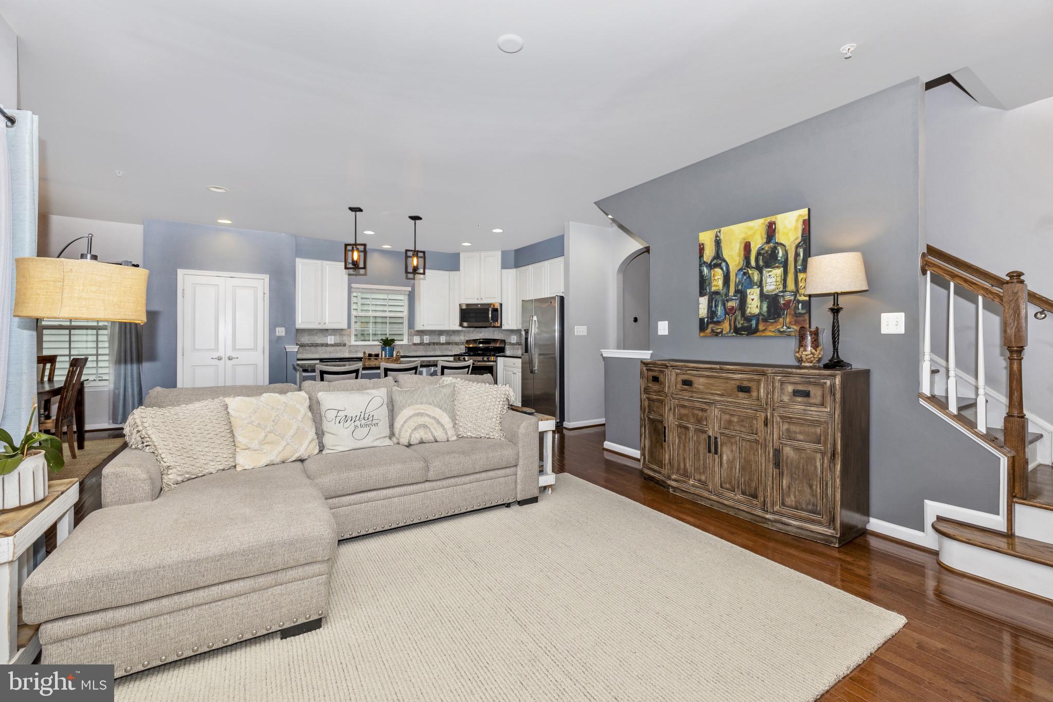 1912 Regiment Way Frederick, MD 21702 - Photo 18 of 45 a living room with furniture a fireplace and a flat screen tv