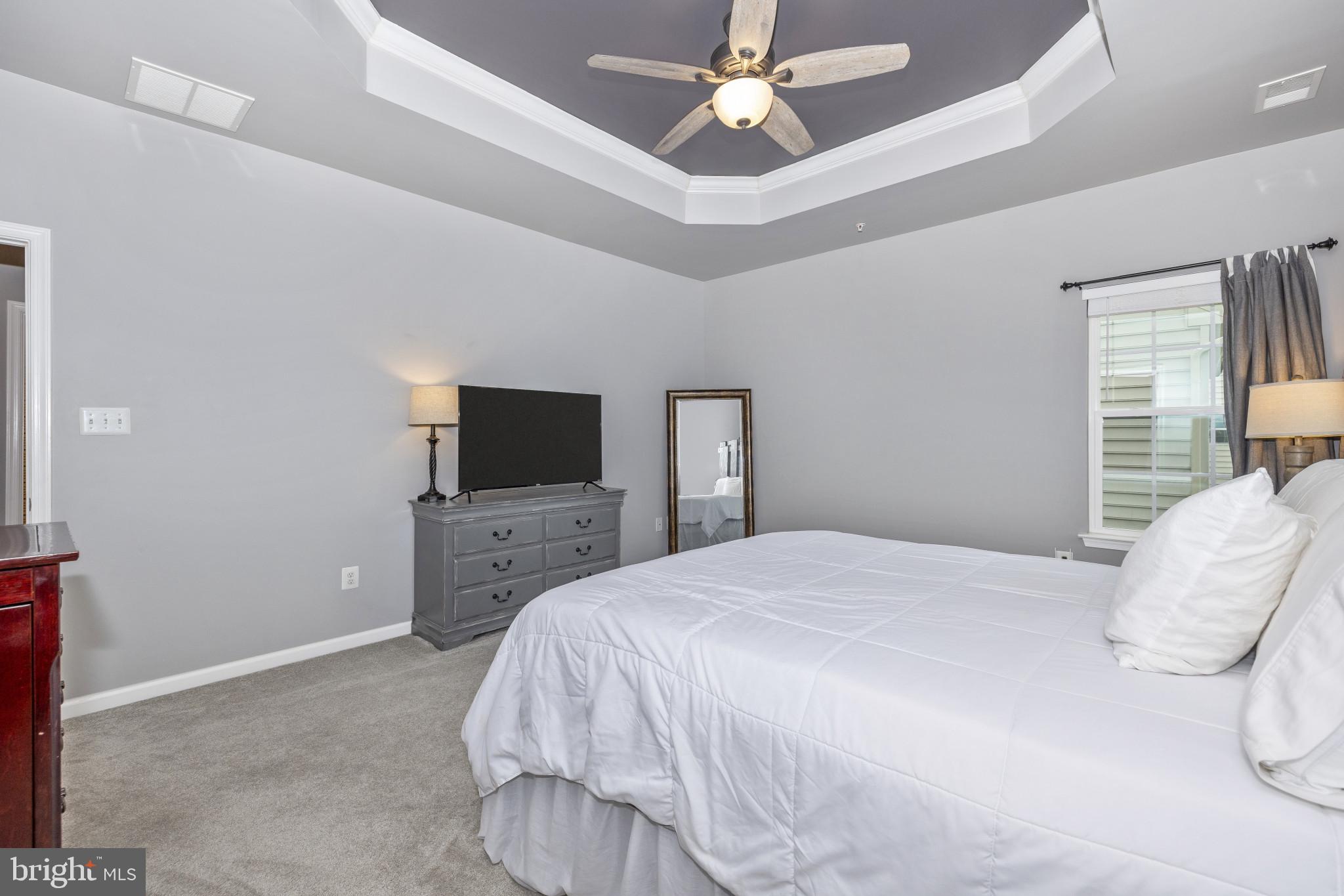1912 Regiment Way Frederick, MD 21702 - Photo 24 of 45 a bedroom with a bed and a flat screen tv