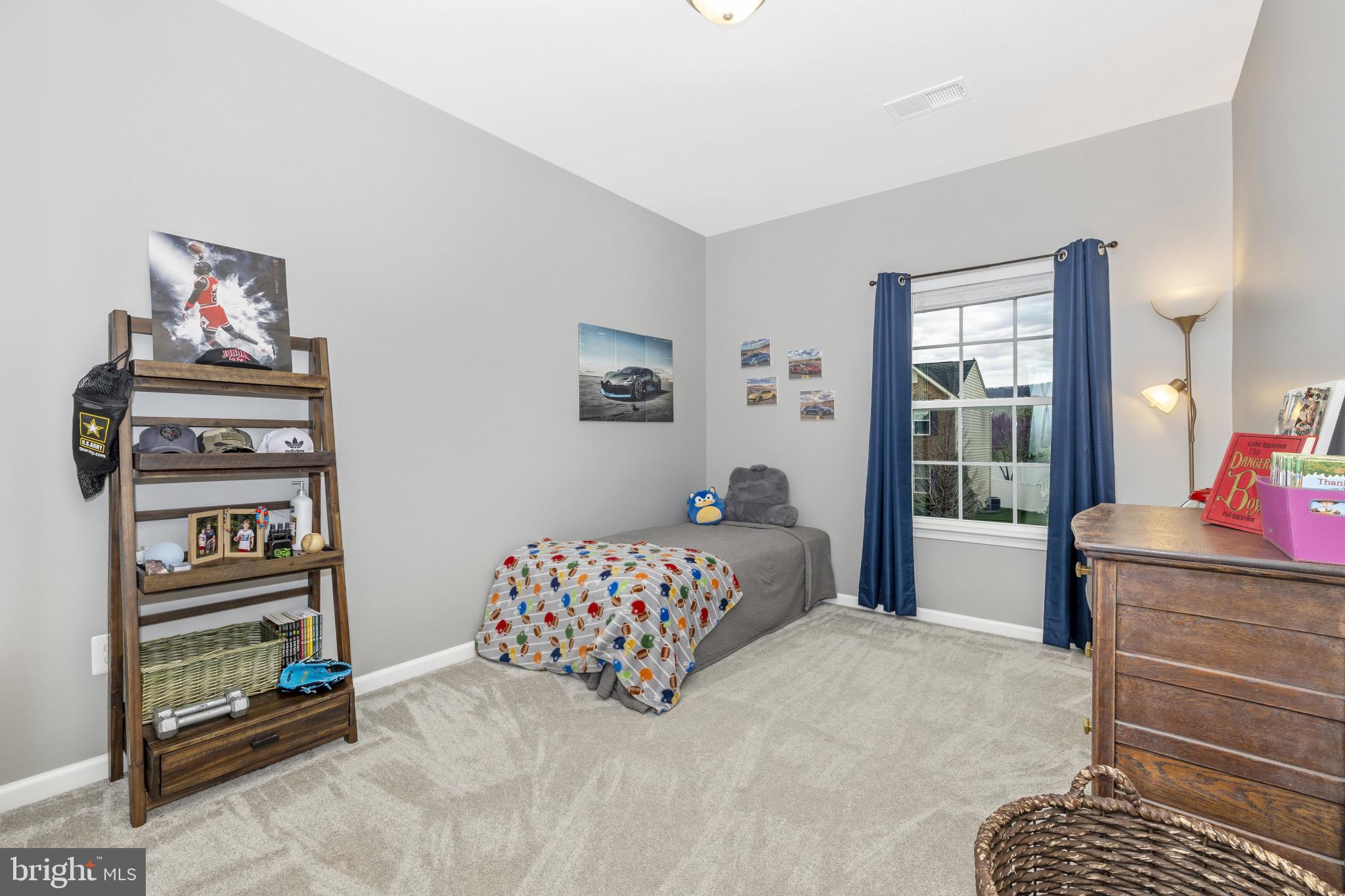 1912 Regiment Way Frederick, MD 21702 - Photo 28 of 45 a bedroom with a bed dresser and a window