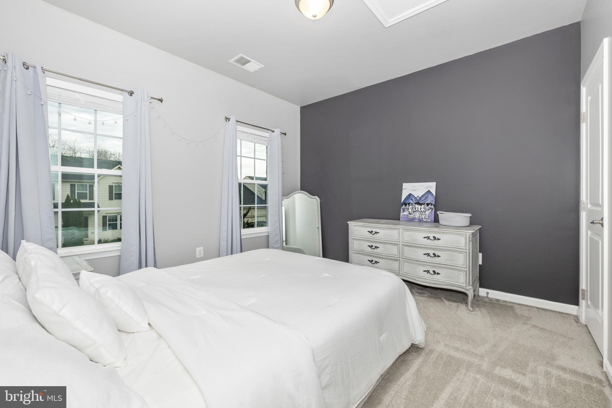 1912 Regiment Way Frederick, MD 21702 - Photo 30 of 45 a bedroom with a bed and wooden floor