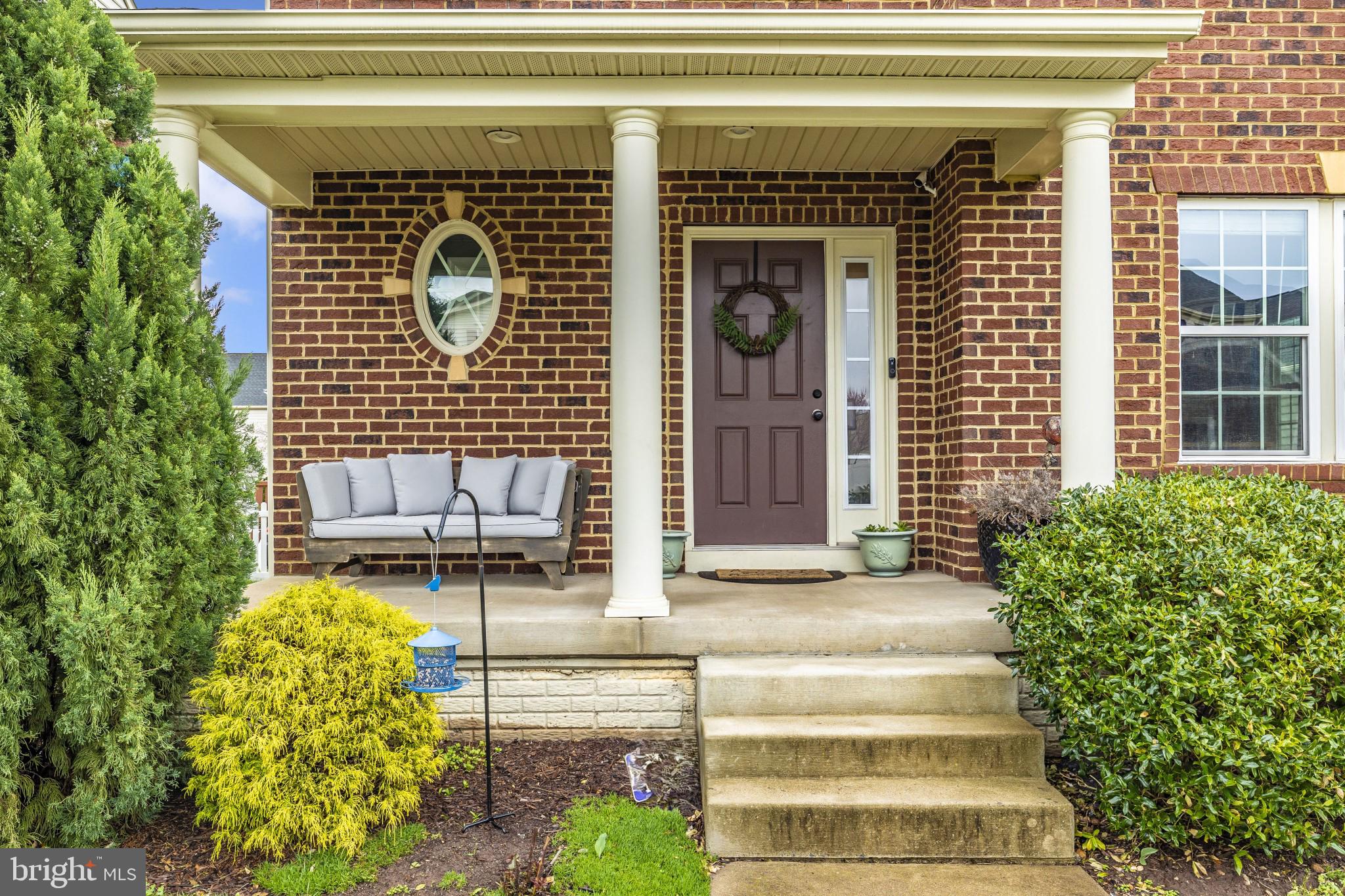 1912 Regiment Way Frederick, MD 21702 - Photo 3 of 45 a front view of a house with a chairs and table chair