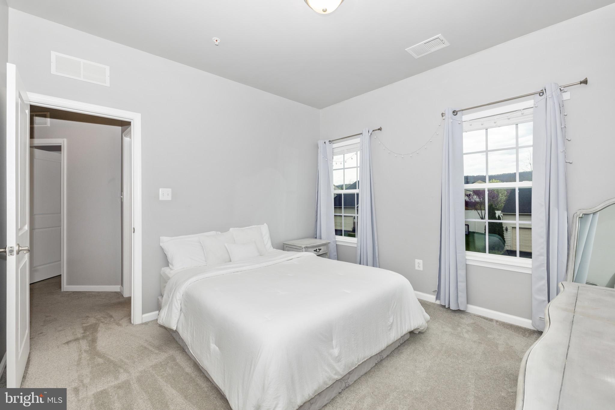 1912 Regiment Way Frederick, MD 21702 - Photo 31 of 45 a bedroom with a large bed and a window