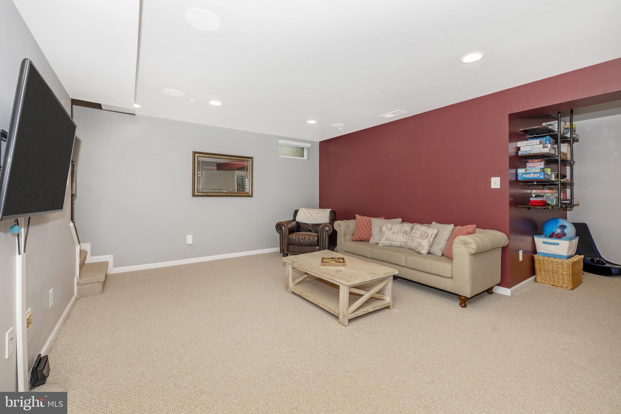 1912 Regiment Way Frederick, MD 21702 - Photo 35 of 45 a living room with furniture and a flat screen tv