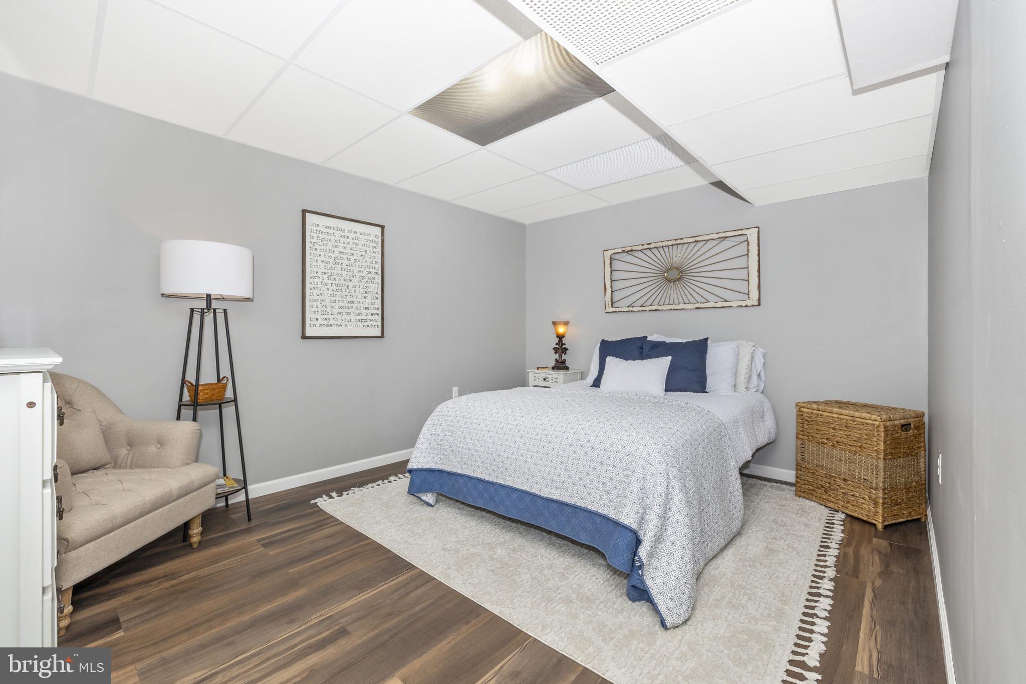 1912 Regiment Way Frederick, MD 21702 - Photo 37 of 45 a bedroom with a bed and a lamp