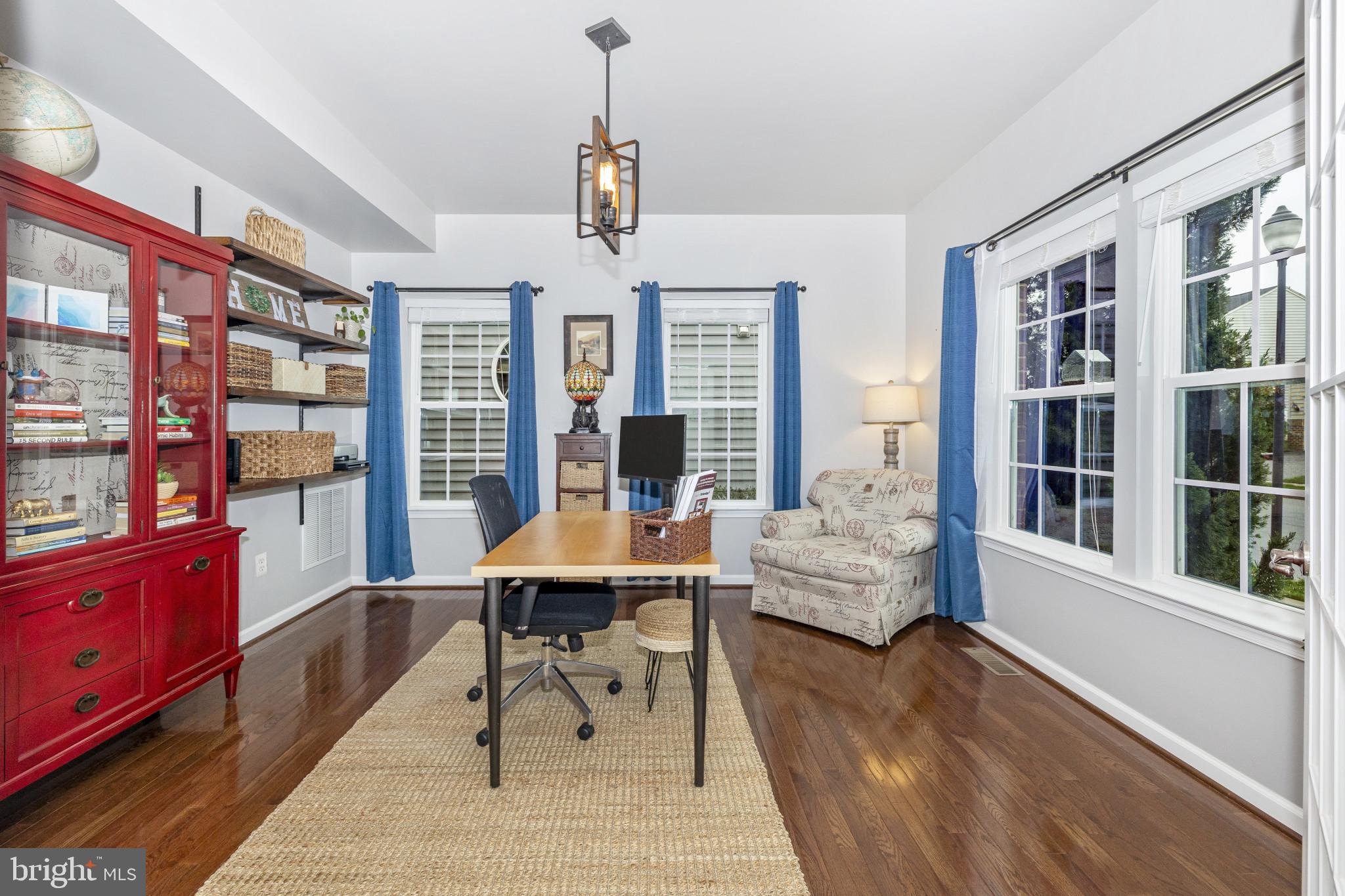 1912 Regiment Way Frederick, MD 21702 - Photo 4 of 45 a living room with furniture and a potted plant