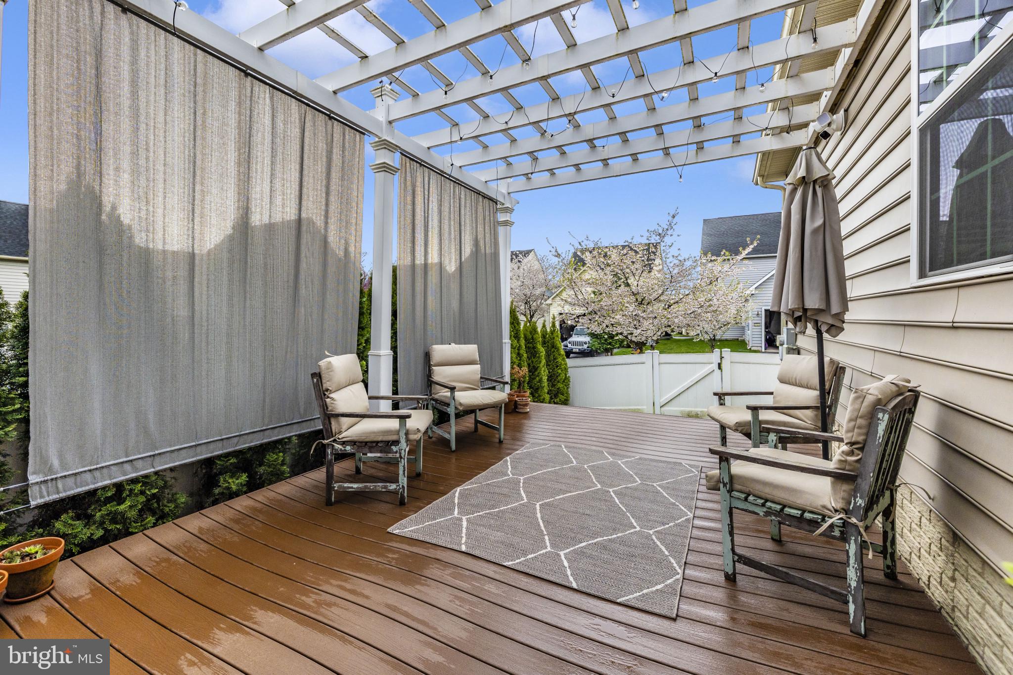 1912 Regiment Way Frederick, MD 21702 - Photo 44 of 45 a view of a patio with table and chairs with wooden floor and fence