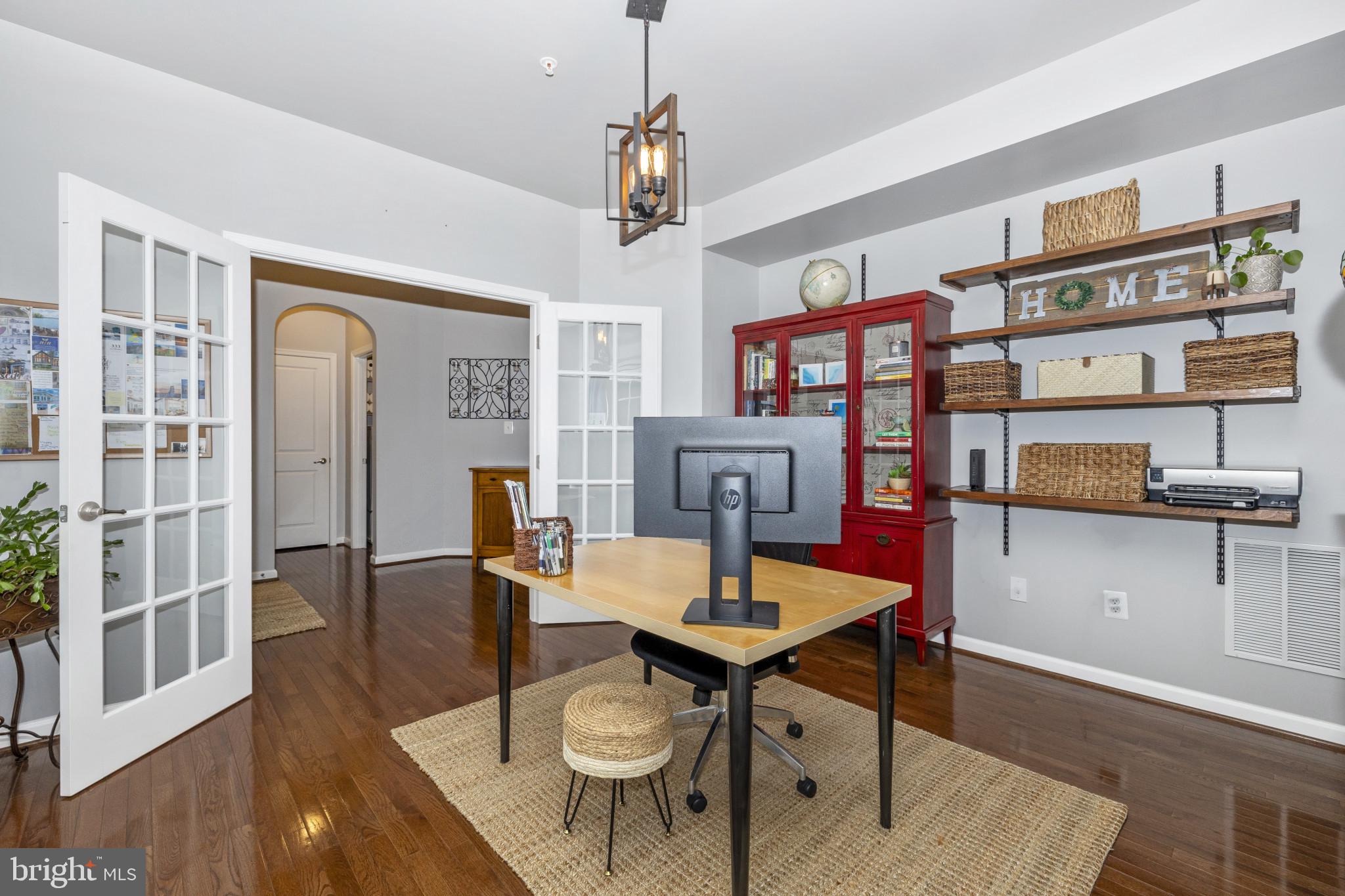 1912 Regiment Way Frederick, MD 21702 - Photo 8 of 45 a view of a dining room with furniture and wooden floor