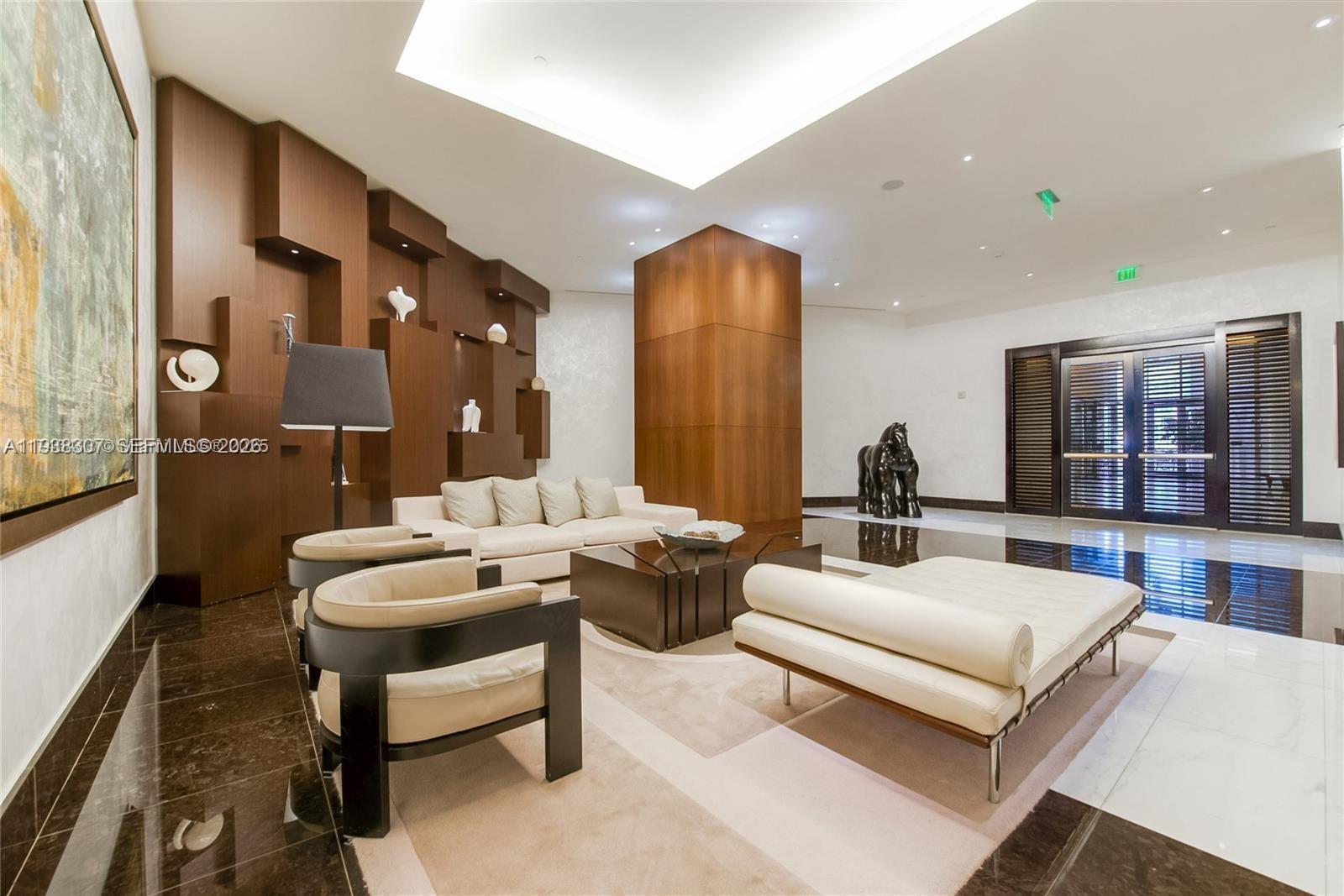 200 Biscayne Blvd Way, Unit 906 Miami, FL 33131 - Photo 31 of 44 a living room with furniture and wooden floor