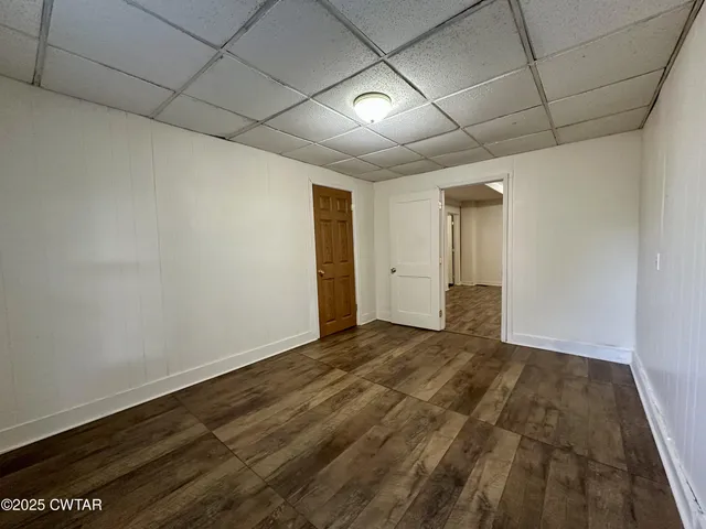 a kitchen with stainless steel appliances granite countertop a refrigerator a stove and a sink