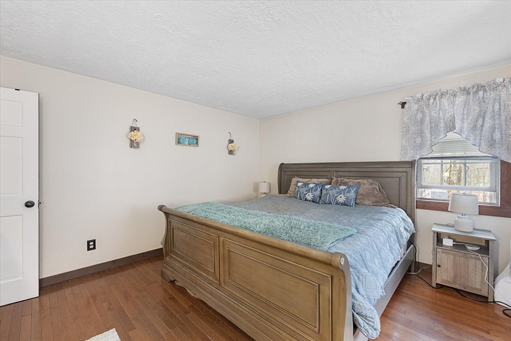 7 Hebert Road Spencer, MA 01562 - Photo 14 of 32 a bedroom with a bed and a window