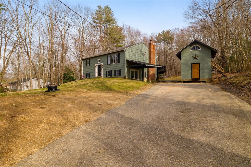7 Hebert Road Spencer, MA 01562 - Photo 2 of 32 a front view of house with yard and trees