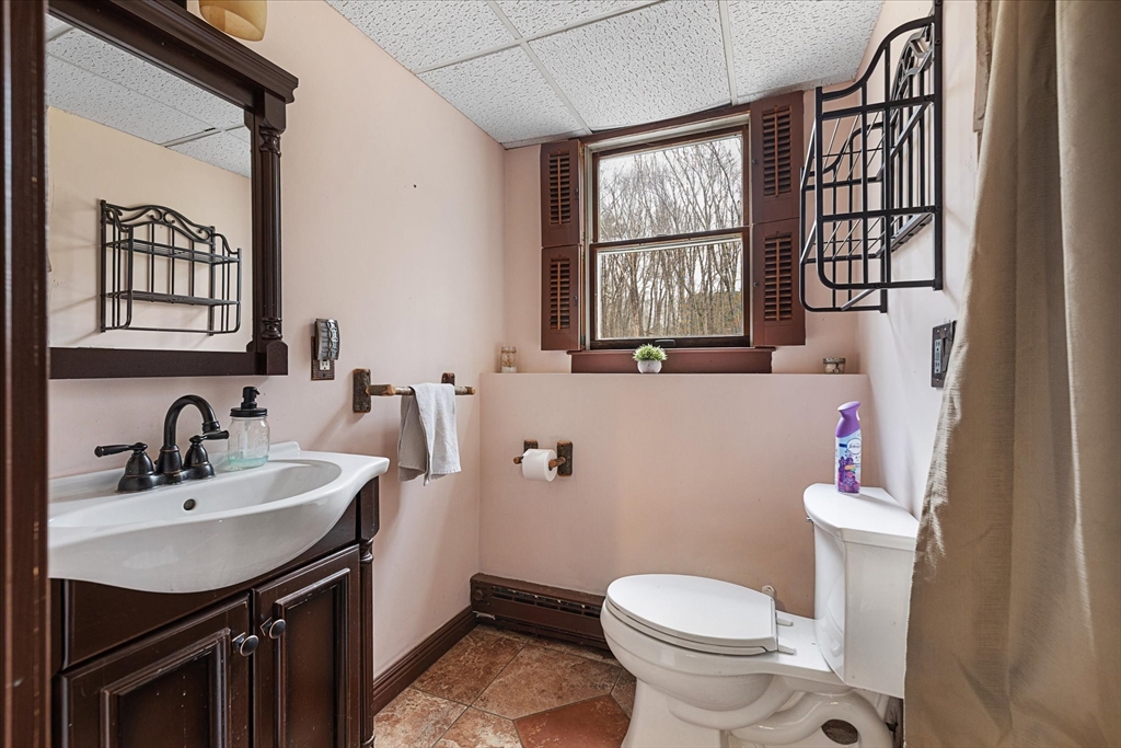 7 Hebert Road Spencer, MA 01562 - Photo 22 of 32 a bathroom with a sink toilet and a mirror