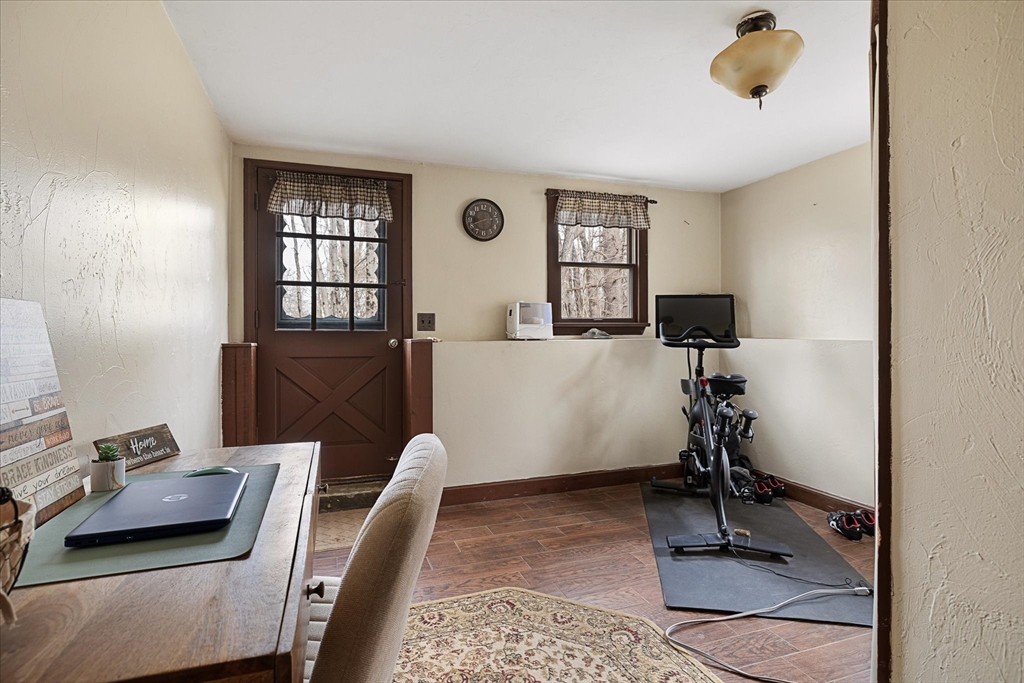 7 Hebert Road Spencer, MA 01562 - Photo 23 of 32 a view of a workspace with furniture and a window