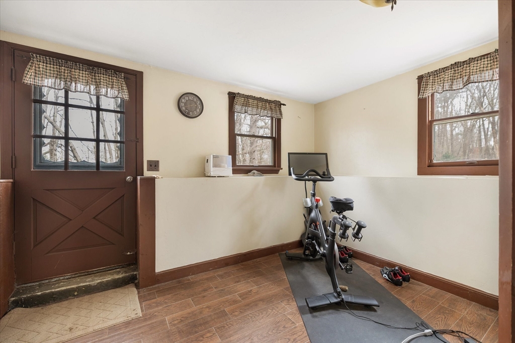 7 Hebert Road Spencer, MA 01562 - Photo 25 of 32 a room with gym equipment and a window