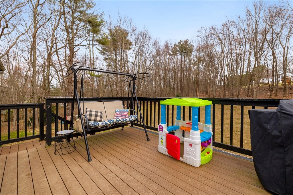 7 Hebert Road Spencer, MA 01562 - Photo 26 of 32 a view of a deck with wooden floor and outdoor seating
