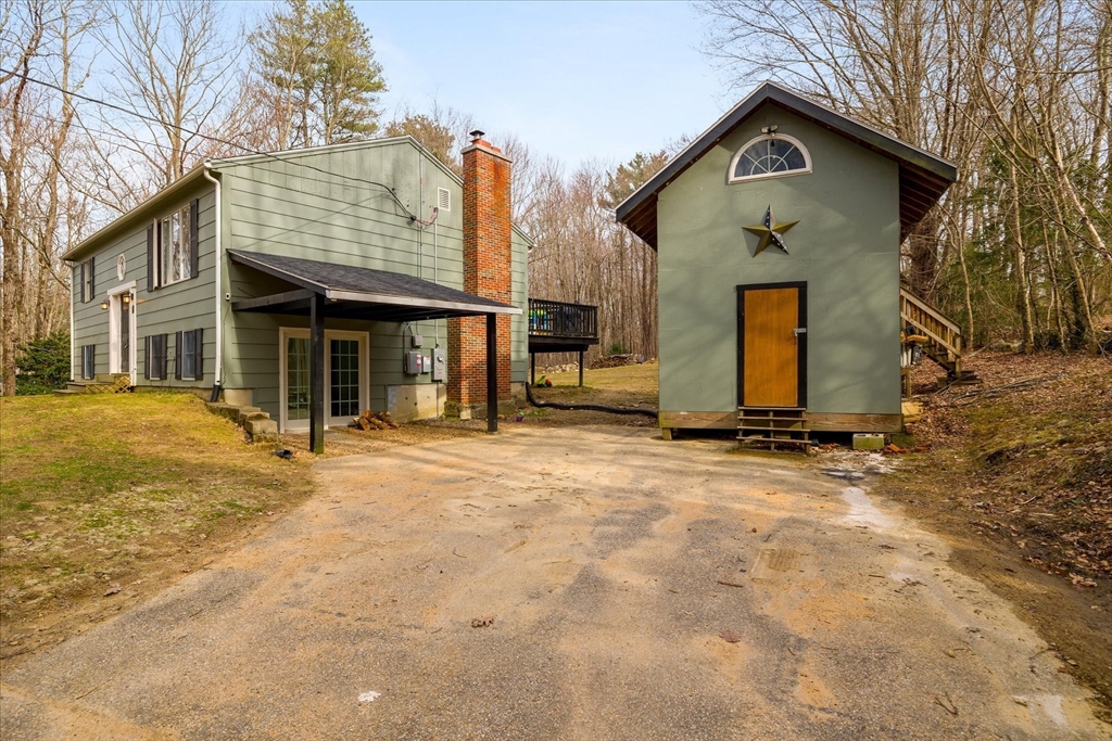 7 Hebert Road Spencer, MA 01562 - Photo 27 of 32 a front view of a house with a yard