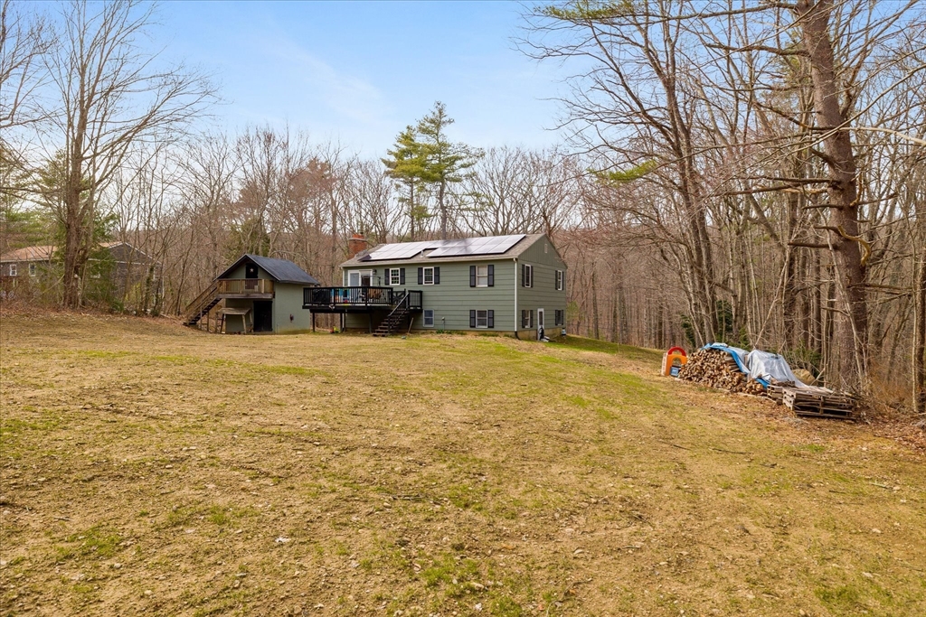 7 Hebert Road Spencer, MA 01562 - Photo 29 of 32 a view of a house with a yard covered in snow