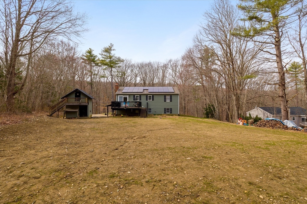 7 Hebert Road Spencer, MA 01562 - Photo 30 of 32 a view of a house with a yard and trees