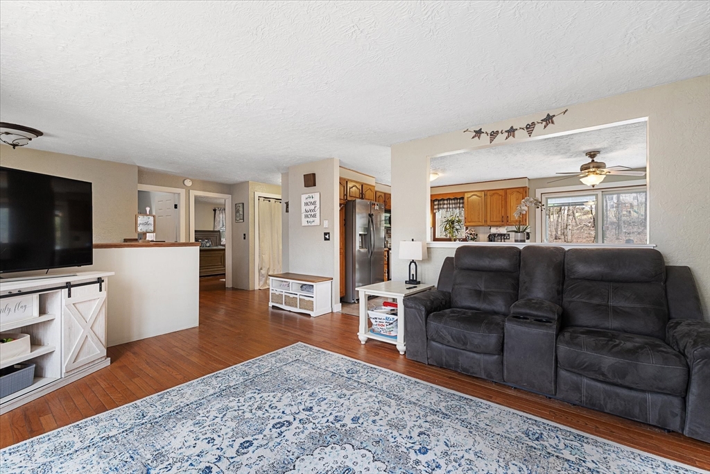 7 Hebert Road Spencer, MA 01562 - Photo 3 of 32 a living room with furniture and a flat screen tv