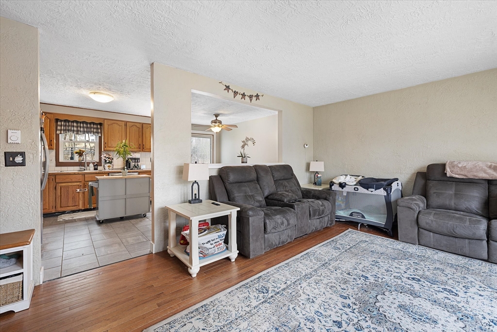 7 Hebert Road Spencer, MA 01562 - Photo 4 of 32 a living room with furniture and a wooden floor