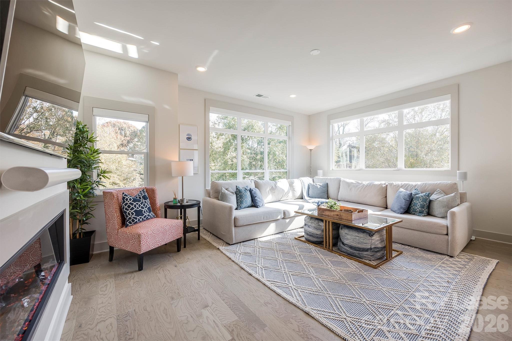 2319 Wesley Village Road Charlotte, NC 28208 - Photo 21 of 44 a living room with furniture and a large window